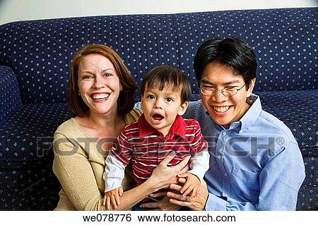 Young white woman and her Asian husband with their toddler Eurasian son. View Large Photo Image Stock Photograph - Young white woman and her Asian husband with their toddler Eurasian son.. Fotosearch