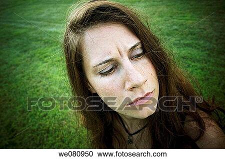 Young woman posing at a park. View Large Photo Image Stock Image - Young woman posing at a park.. Fotosearch