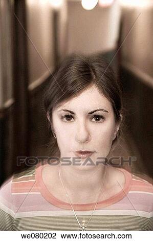 Young woman posing in the hallway of her apartment building View Large Photo Image Stock Image - Young woman posing in the hallway of her apartment building. Fotosearch