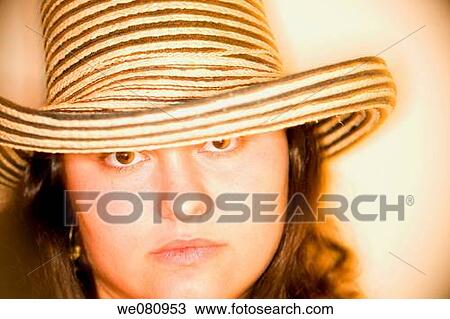 Young woman wearing a hat. View Large Photo Image Stock Image - Young woman wearing a hat.. Fotosearch