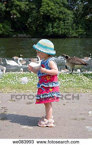 16 month old girl is walking along the Thameside Promenade Reading Berkshire England View Large Photo Image Stock Image - 16 month old girl is walking along the Thameside Promenade Reading Berkshire England. Fotosearch