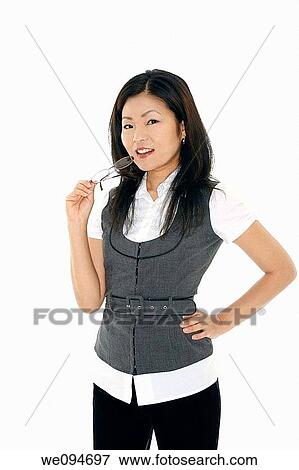 A beautiful and confident Asian businesswoman on white background View Large Photo Image Stock Photo - A beautiful and confident Asian businesswoman on white background. Fotosearch