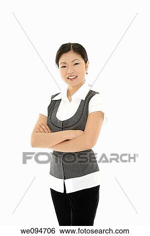 Stock Photograph - A beautiful and confident Asian businesswoman on white background. Fotosearch