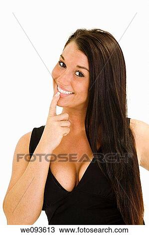 A beautiful caucasian woman smiling at the camera She is standing on a white background View Large Photo Image Stock Image - A beautiful caucasian woman smiling at the camera She is standing on a white background. Fotosearch