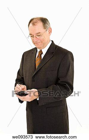 A caucasian businessman with a receding hairline wearing a black business suit and white shirt He is shown on a white background and working with a pda View Large Photo Image Stock Image - A caucasian businessman with a receding hairline wearing a black business suit and white shirt He is shown on a white background and working with a pda. Fotosearch