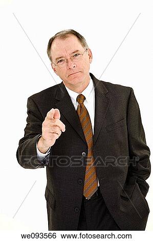 A caucasian businessman with a receding hairline wearing a black business suit and white shirt He is shown on a white background pointing his finger and looking upset View Large Photo Image Stock Photograph - A caucasian businessman with a receding hairline wearing a black business suit and white shirt He is shown on a white background pointing his finger and looking upset. Fotosearch