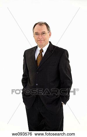 A caucasian businessman with a receding hairline wearing a black business suit and white shirt He is shown on a white background with hands in pockets View Large Photo Image Stock Photograph - A caucasian businessman with a receding hairline wearing a black business suit and white shirt He is shown on a white background with hands in pockets. Fotosearch