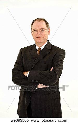 A caucasian businessman with a receding hairline wearing a black business suit and white shirt He is shown on a white background with hands on hips and is smiling View Large Photo Image Stock Photography - A caucasian businessman with a receding hairline wearing a black business suit and white shirt He is shown on a white background with hands on hips and is smiling. Fotosearch