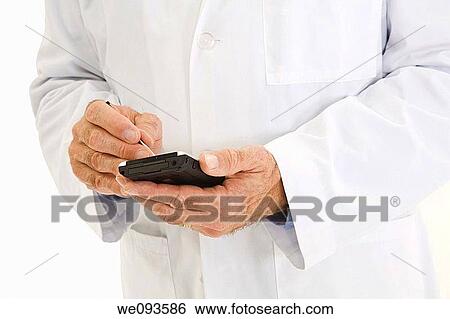 A caucasian doctor wearing a white lab coat He is shown on a white background working with a pda View Large Photo Image Stock Photograph - A caucasian doctor wearing a white lab coat He is shown on a white background working with a pda. Fotosearch