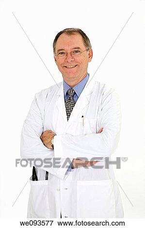 A caucasian doctor with a receding hairline wearing a white lab coat He is shown on a white background with arms folded and is smiling View Large Photo Image Stock Photo - A caucasian doctor with a receding hairline wearing a white lab coat He is shown on a white background with arms folded and is smiling. Fotosearch