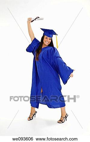 A female caucasian in blue graduation gown and very excited She is on a white background View Large Photo Image Stock Photograph - A female caucasian in blue graduation gown and very excited She is on a white background. Fotosearch