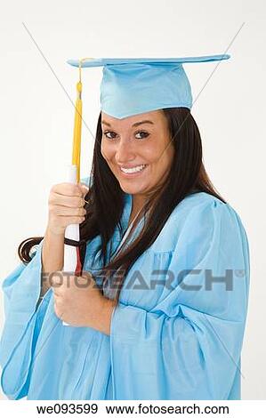 A female caucasian in light blue graduation gown and very excited She is on a white background View Large Photo Image Stock Photo - A female caucasian in light blue graduation gown and very excited She is on a white background. Fotosearch