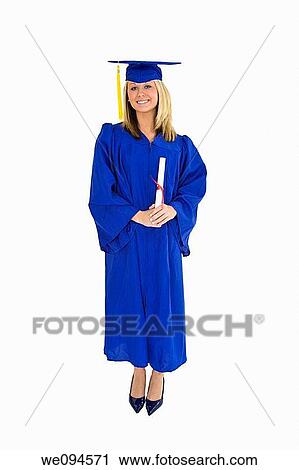 A female caucasian with blond hair standing in blue graduation gown and smiling She is on a white background View Large Photo Image Stock Image - A female caucasian with blond hair standing in blue graduation gown and smiling She is on a white background. Fotosearch