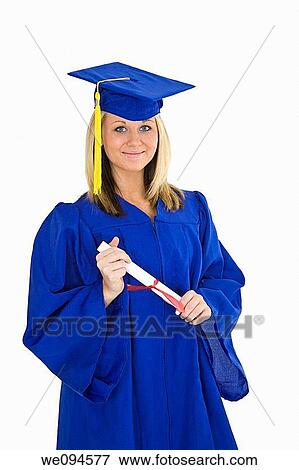 A female caucasian with blond hair standing in blue graduation gown and smiling She is on a white background View Large Photo Image Stock Photo - A female caucasian with blond hair standing in blue graduation gown and smiling She is on a white background. Fotosearch