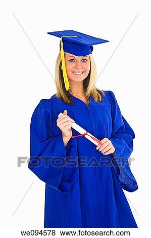 A female caucasian with blond hair standing in blue graduation gown and smiling She is on a white background View Large Photo Image Stock Photo - A female caucasian with blond hair standing in blue graduation gown and smiling She is on a white background. Fotosearch