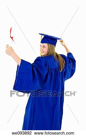 A preteen caucasian girl with blond hair standing in blue graduation gown and smiling She is on a white background View Large Photo Image Stock Image - A preteen caucasian girl with blond hair standing in blue graduation gown and smiling She is on a white background. Fotosearch
