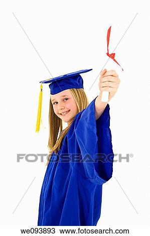 A preteen caucasian girl with blond hair standing in blue graduation gown and smiling She is on a white background View Large Photo Image Stock Image - A preteen caucasian girl with blond hair standing in blue graduation gown and smiling She is on a white background. Fotosearch