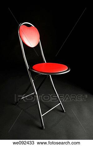 A red chair on a black studio background View Large Photo Image Stock Image - A red chair on a black studio background. Fotosearch