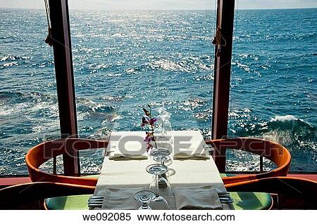 A table for two by a window on a cruise ship View Large Photo Image Stock Photography - A table for two by a window on a cruise ship. Fotosearch