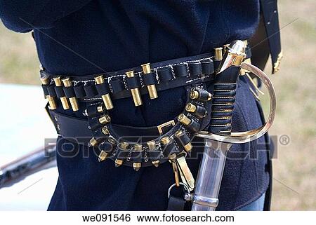 A US Cavalry soldier displays a sword and ammunition belt as part of his period uniform at reenactment of Custer's Last Stand View Large Photo Image Stock Photograph - A US Cavalry soldier displays a sword and ammunition belt as part of his period uniform at reenactment of Custer's Last Stand. Fotosearch