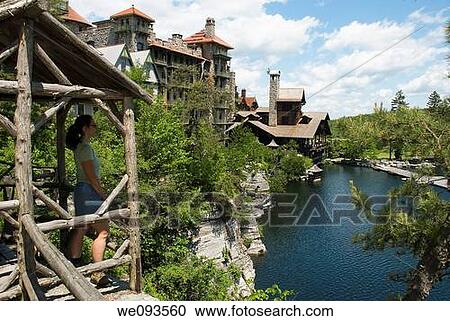 a visitor looks out over Mohonk Lake towards Mohonk Mountain House View Large Photo Image Stock Image - a visitor looks out over Mohonk Lake towards Mohonk Mountain House. Fotosearch