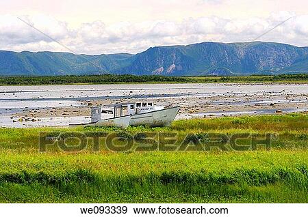 Abandoned boats at Parsons Pond Newfoundland with Gros Morne Long Range Mountains View Large Photo Image Stock Photo - Abandoned boats at Parsons Pond Newfoundland with Gros Morne Long Range Mountains. Fotosearch