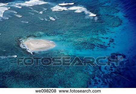 Aerial view of a sandy island in the middle of the pacific ocean View Large Photo Image Stock Photo - Aerial view of a sandy island in the middle of the pacific ocean. Fotosearch