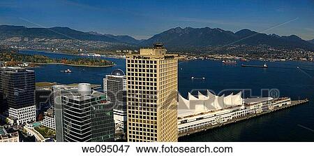 Aerial view of Burrard Inlet with North and West Vancouver from downtown and coastal mountain range View Large Photo Image Stock Photo - Aerial view of Burrard Inlet with North and West Vancouver from downtown and coastal mountain range. Fotosearch