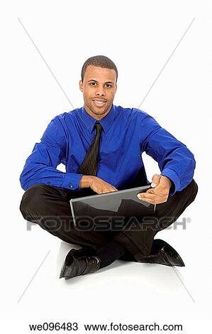 African American businessman sitting on white background View Large Photo Image Stock Image - African American businessman sitting on white background. Fotosearch