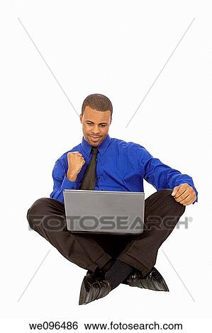 African American businessman sitting on white background View Large Photo Image Stock Photograph - African American businessman sitting on white background. Fotosearch