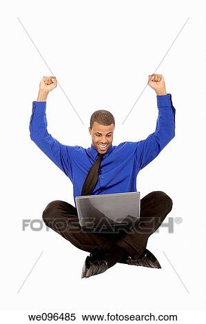 African American businessman sitting on white background View Large Photo Image Stock Photography - African American businessman sitting on white background. Fotosearch