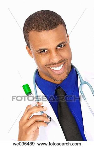 Stock Photo - African American doctor holding a syringe. Fotosearch