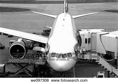 Stock Photo - Airplane parked waiting for passengers. Fotosearch
