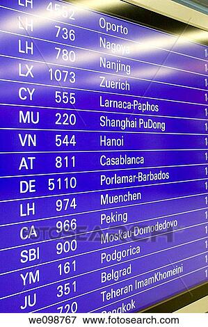 Stock Photo - Airport flight departure screen showing international flights schedule Frankfurt Airport, Germany. Fotosearch