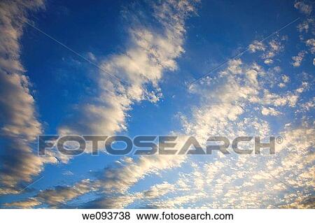 Altocumulus Cloud formation on a blue sky day View Large Photo Image Stock Photo - Altocumulus Cloud formation on a blue sky day. Fotosearch