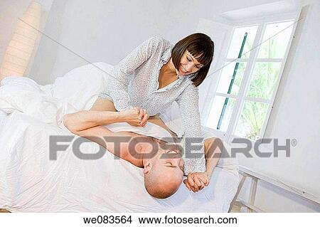 amusement, bedroom, bed, at-home, affection View Large Photo Image Picture - amusement, bedroom, bed, at-home, affection. Fotosearch