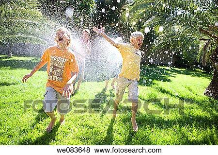 amusement, brother, boy, barefoot, action View Large Photo Image Stock Photo - amusement, brother, boy, barefoot, action. Fotosearch