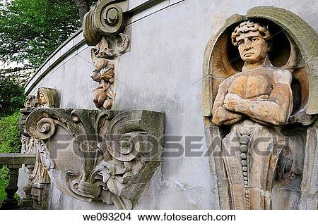 Picture - Ancient wall stone carving in the Guild Sculpture Gardens Toronto at dusk. Fotosearch
