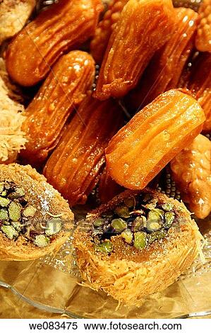 Arabic Sweets - Konafa and Sesame Honey Fritters View Large Photo Image Stock Photography - Arabic Sweets - Konafa and Sesame Honey Fritters. Fotosearch