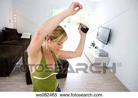 Arms raised, at-home, amusement View Large Photo Image Stock Photography - Arms raised, at-home, amusement. Fotosearch