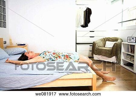 Arms raised, barefoot, at-home, apartment View Large Photo Image Stock Photo - Arms raised, barefoot, at-home, apartment. Fotosearch