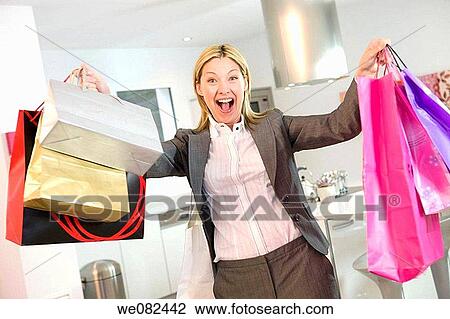 Arms raised, blond, bag, at-home, addiction View Large Photo Image Stock Image - Arms raised, blond, bag, at-home, addiction. Fotosearch