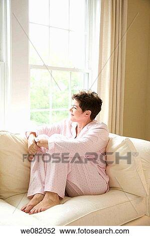 at-home, barefoot, baby boomer, absorbed View Large Photo Image Stock Image - at-home, barefoot, baby boomer, absorbed. Fotosearch