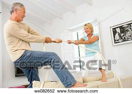 at-home, Battle of the sexes, barefoot, amusement View Large Photo Image Stock Image - at-home, Battle of the sexes, barefoot, amusement. Fotosearch