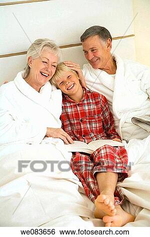 at-home, bed, bathrobe, barefoot, affection View Large Photo Image Stock Photograph - at-home, bed, bathrobe, barefoot, affection. Fotosearch