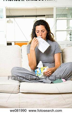 Stock Image - at-home, Blowing nose, Blow nose, apartment. Fotosearch