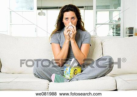Stock Photo - at-home, Blowing nose, Blow nose, apartment. Fotosearch