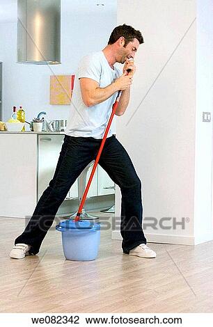 Stock Image - at-home, bucket, black hair, amusing. Fotosearch