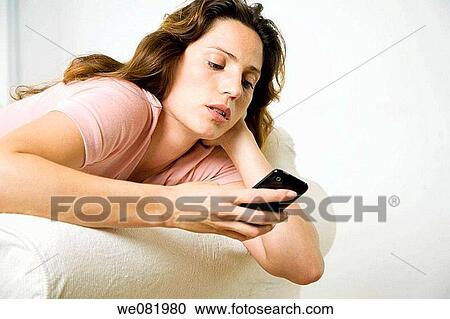 at-home, calling, brown hair, addiction View Large Photo Image Stock Image - at-home, calling, brown hair, addiction. Fotosearch