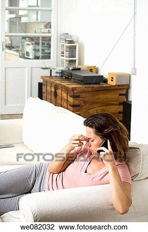 at-home, calling, brown hair, apartment View Large Photo Image Stock Image - at-home, calling, brown hair, apartment. Fotosearch